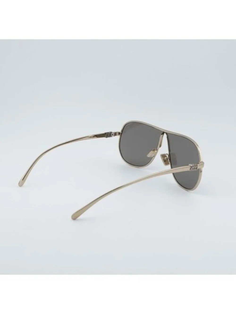 Miu Miu MUA56S ZVN80Q Sunglasses Pale Gold Geometric Frame, Dark Grey Lenses